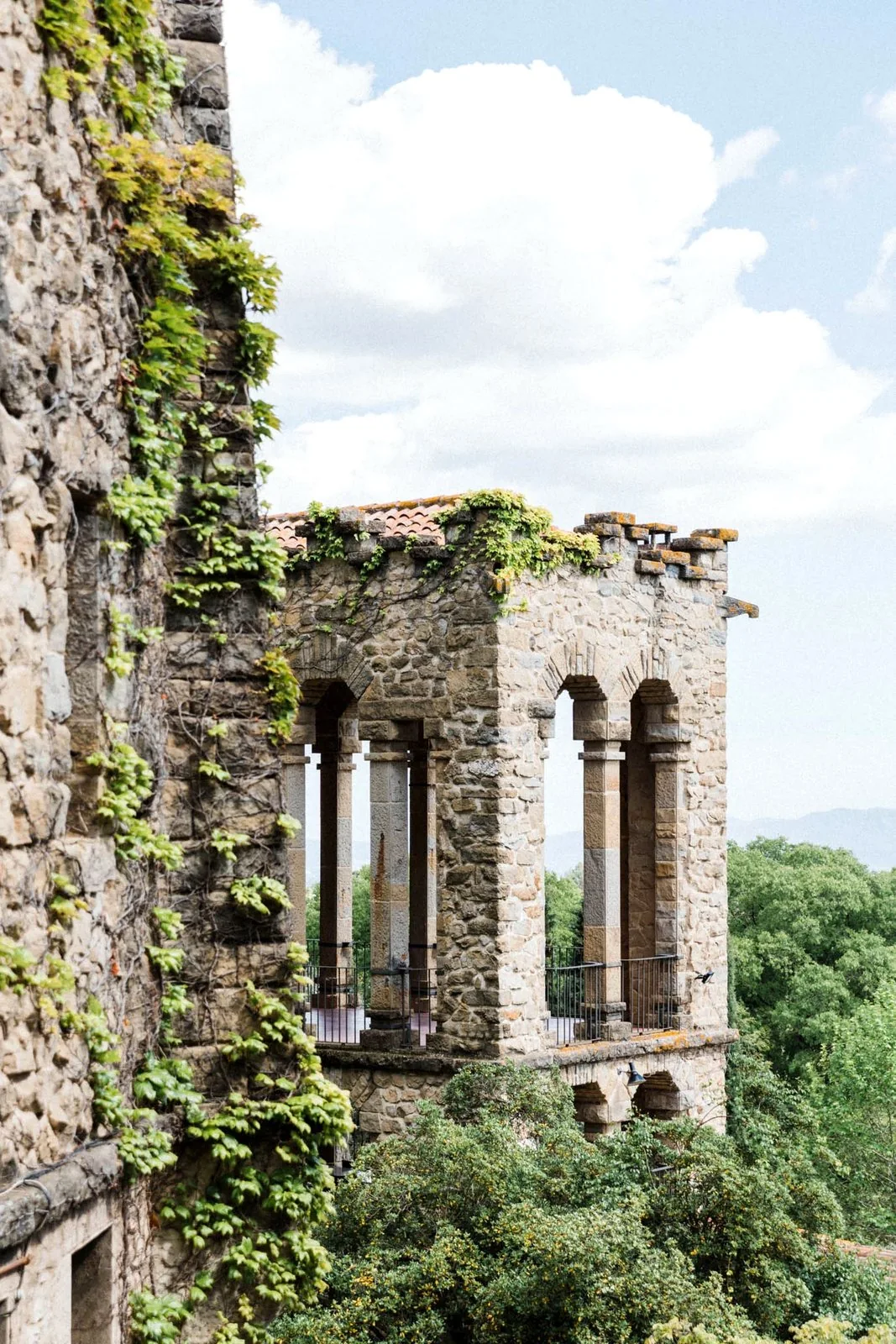 The stone arched loggia at La Baronia overlooking the valley and hills